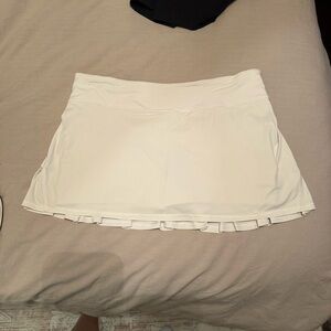 Lulu White Tennis Skirt with pleated back Ruffle Hem